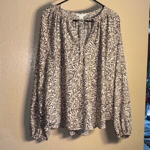 H&M oversized white with black floral pattern blouse with tie around the neck,
